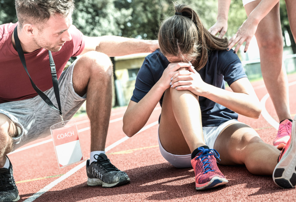 female athlete getting injured during athletic run 2021 08 31 04 26 47 utc